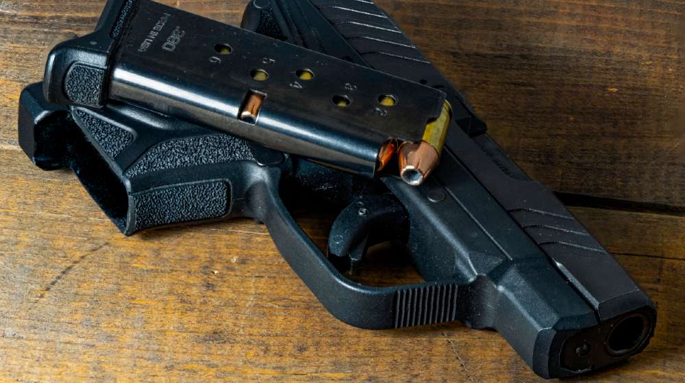 .380 caliber semi-automatic handgun and magazine loaded with hollow point ammunition | The Top 380 ACP Handguns | Featured