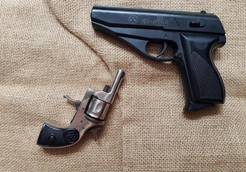 Modern gun and old revolver | 25 caliber handgun