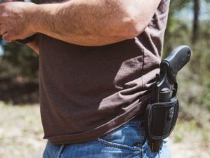 Close up side view of a man wearing an open | Top 5 Carry Guns Under $300 | Featured
