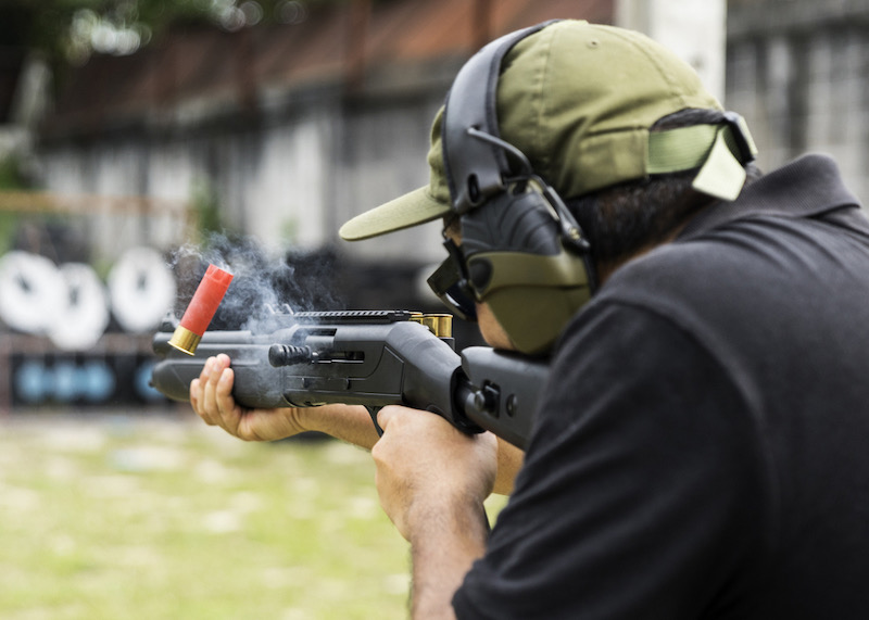 Man shooting on an outdoor shooting range | best 20 gauge home defense shotgun