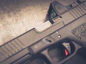 Custom Handgun laying on on table close up | Are Pistol Sights Actually Useful For Self Defense? | Featured