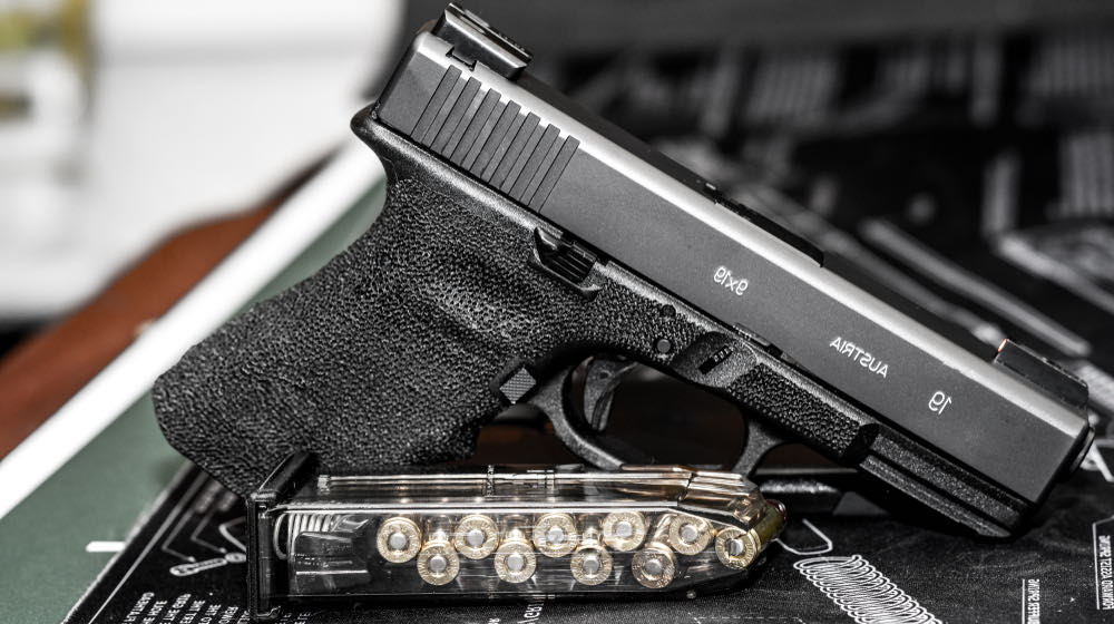 Glock 19 handgun with green night sights | PSA Dagger 9 Gun Review | featured