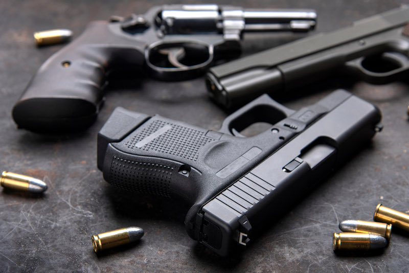 Gun, Pistol with ammunition on wooden background | psa dagger restock