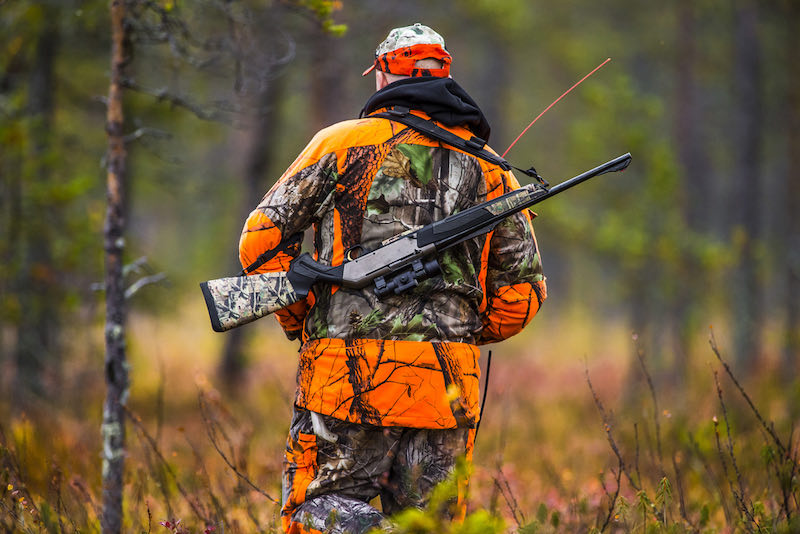 Hunter in the fall hunting season | long range shooting school