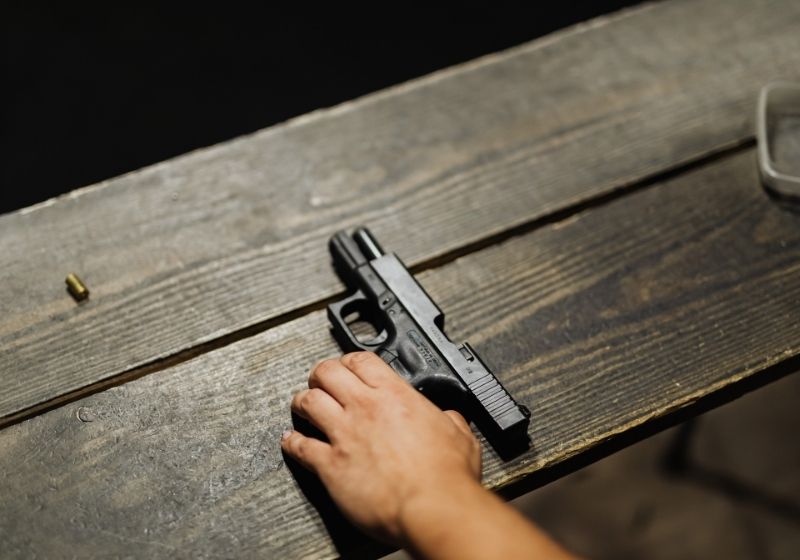Person holding black semi automatic pistol Star bm 9mm PX
