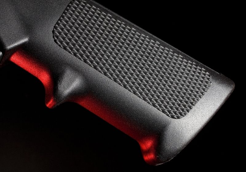Pistol grip on an assault weapon taken when a red gel Keltec p50 SS