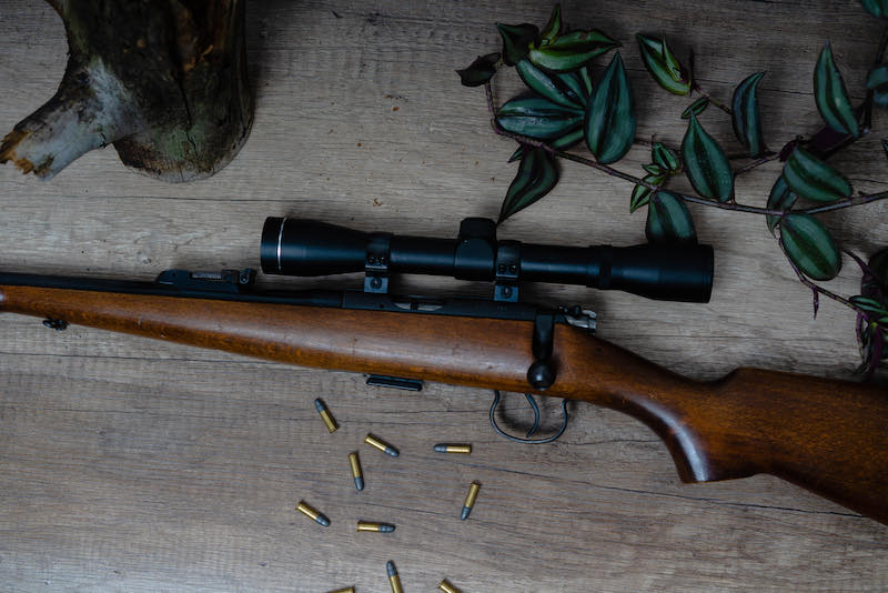 Top view of beautiful rifle with wood stock | tactical home defense rifles