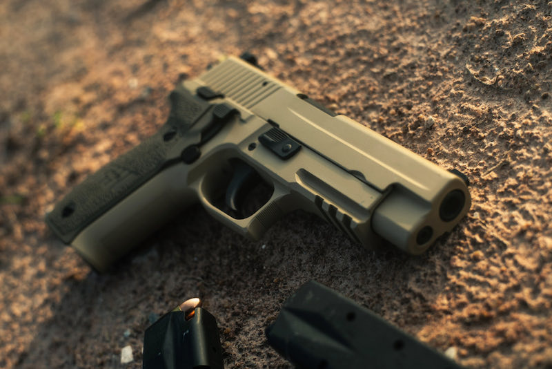 handgun pistol on the sand floor | psa dagger delay