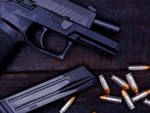 Sig's P365 Handgun Family | Gun is a dangerous weapon on a black background | Featured