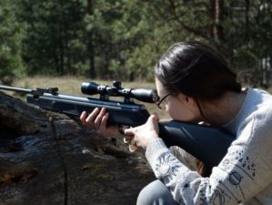 Girl with gun in the forest Tikka rifles | Top 5 Best Tikka Rifles For Hunting | Featured