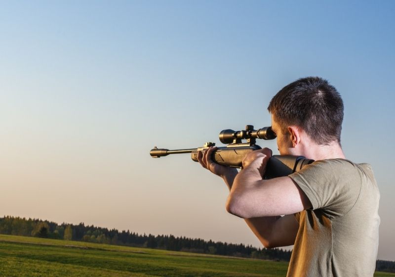 Young man took aim with your sniper rifle How to aim a rifle SS