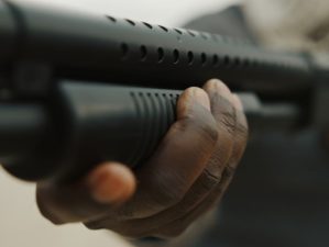 Afro-American man reloads pump action shotgun | DP-12 | Double Barrel Pump Shotgun Gun Full Review | Featured