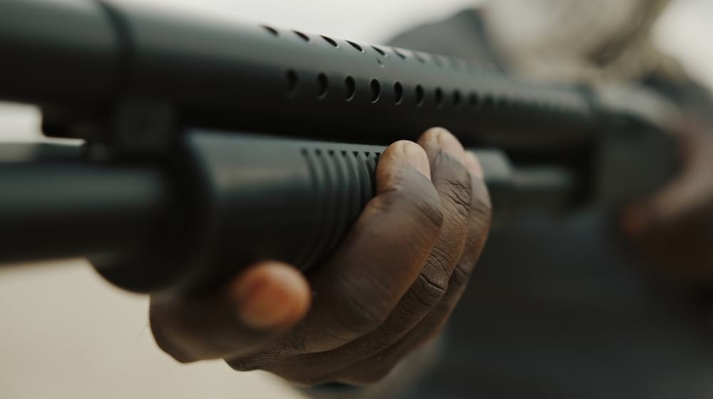 Afro-American man reloads pump action shotgun | DP-12 | Double Barrel Pump Shotgun Gun Full Review | Featured