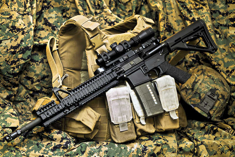 Tactical Vest with Rifle | best military rifles to own