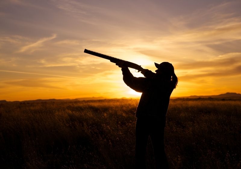 Woman Hunter Silhouetted in Sunset | shotgun for women