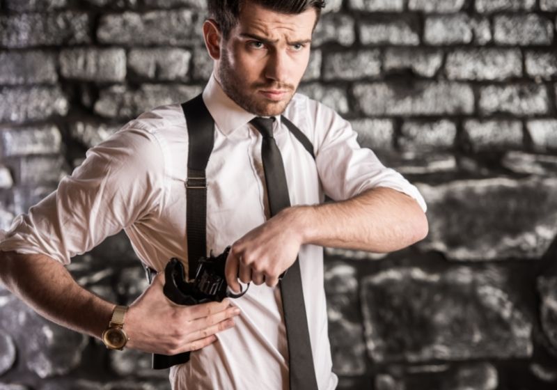 Young, confident, gangster pulls a revolver | Top 5 Best Shoulder Holster for 2021 | Shoulder Holster