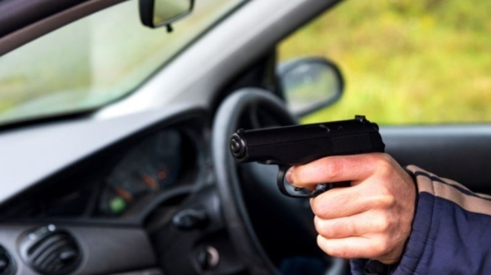 Man with a gun driving a car male hand with a gun |Mouse Gun | Top 10 Best Mouse Gun | Featured