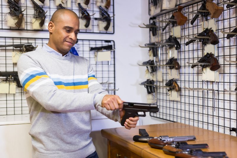 Man Disassembles a Pistol in a Gun Store | Taurus PT111 G2