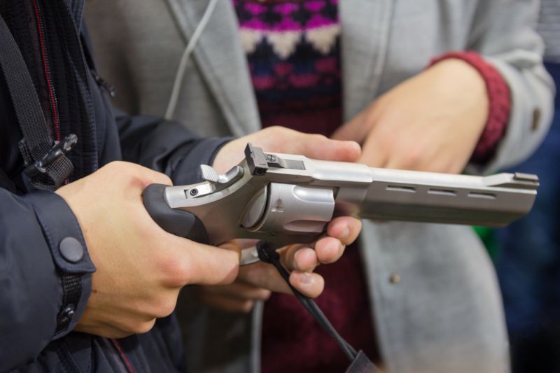 man-holding-revolver-gun-shop-sales online guns SS