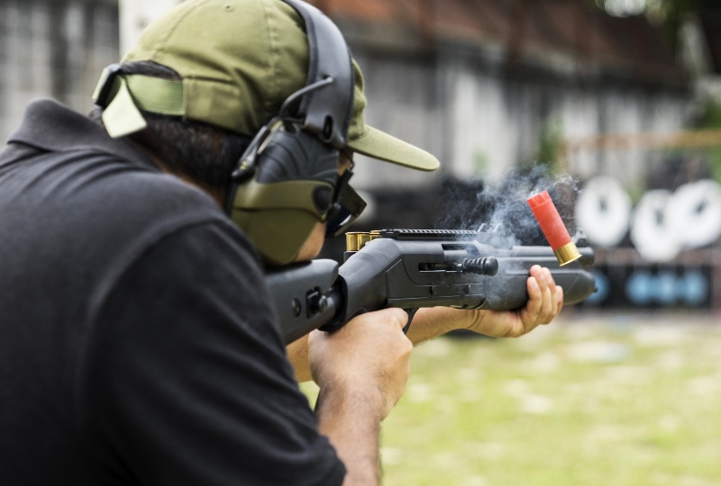 Man Shooting on an Outdoor Shooting Range | Smith and Wesson Shotgun