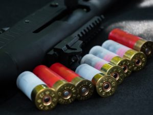 Shotgun Cartridges on Black Leather Background | Smith and Wesson Shotgun | Featured