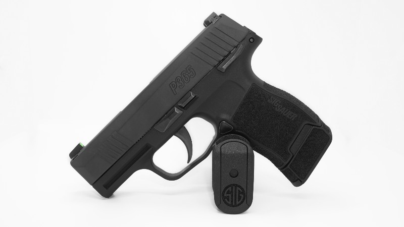 9 mm. micro-compact pistol gun on white background-Sig Sauer P365