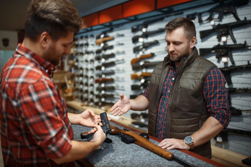 man-owner-choosing-handgun-gun-shop Gun Business SS