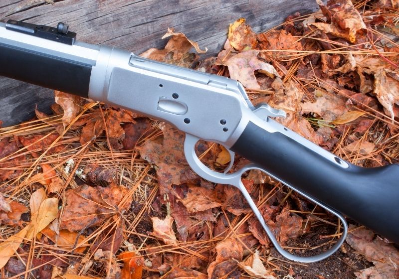 Lever action rifle that is on autumn colored leaves| Top 10 Best 357 Magnum Lever Action Rifles
