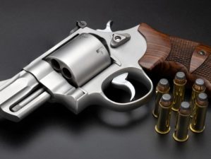 44 Magnum Revolver Handgun with Ammunition on Black Background | 44 Magnum Revolver | Featured