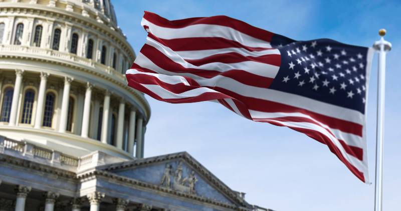 American flag waving with the US Capitol Hill | red flag laws