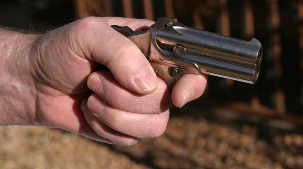An antique 2 shot .45 cal derringer hand gun | Tiny Guns That Can Shoot REAL BULLETS | 10 of the World's Smallest Guns | Featured