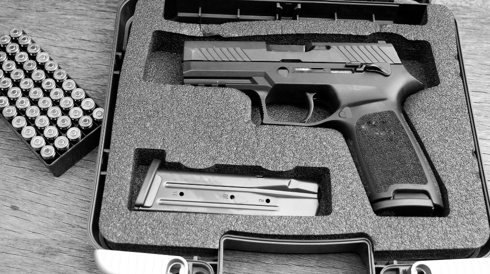 Guns and ammunition in the safe box Pistol case Featured SS min