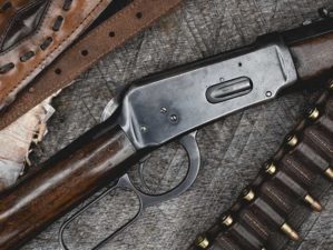 Lever-action hunting rifle with bandolier and ammunition | Top 10 Best Lever Action Rifles in the World 2022 | Featured