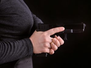 Close-Up Side View of a Gun Pulled from Holster | Glocks for Women | Featured