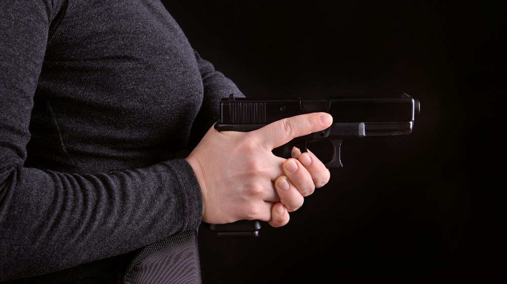 Close-Up Side View of a Gun Pulled from Holster | Glocks for Women | Featured