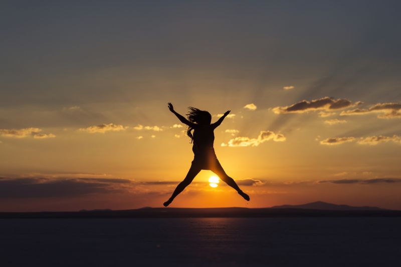 woman jumping joy happines on sunset Packets Of Happiness 