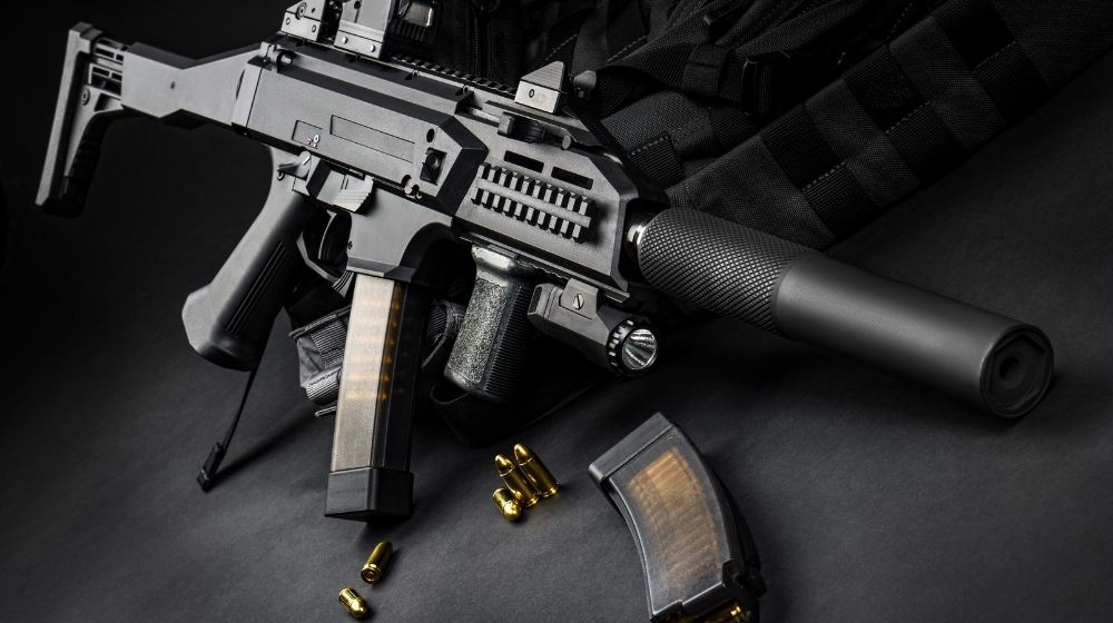 Modern automatic rifle with a silencer and a collimator | 5 Top Hand Guns that are Worth More than Your Tax Money | Featured