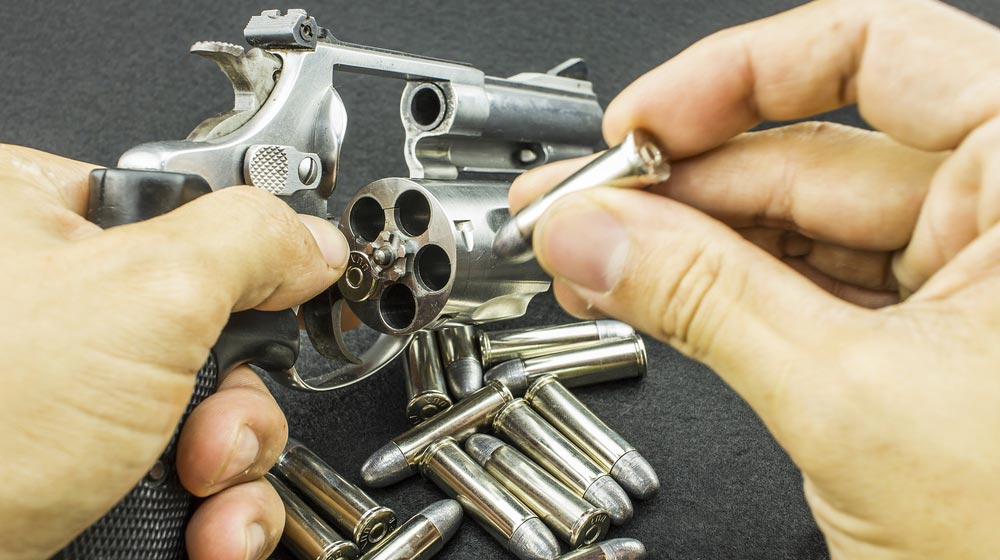 hand reloading a revolver | Taurus Judge Ammo Types | Featured