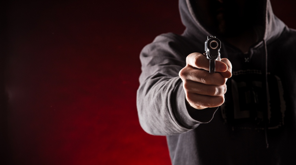 Killer with Gun Close-Up on Dark Background | CSX Micro 9 | Featured