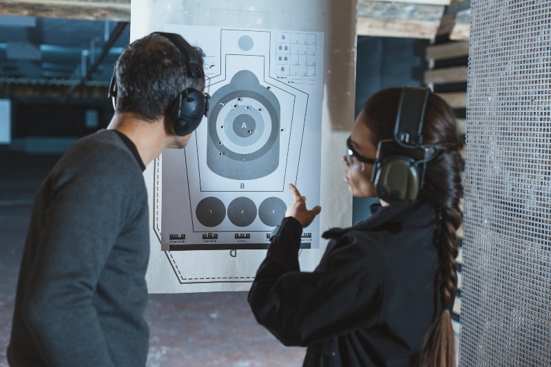 Shooting Instructor Pointing on Used Target | CZ P10 F Competition 1000 Round Review