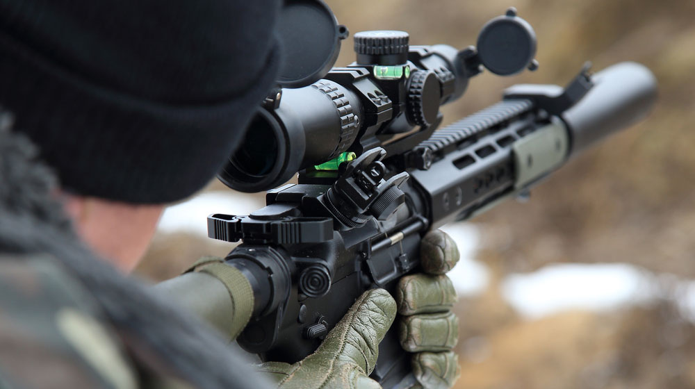 sniper rifle in the hands of a sniper shooter | Best 338 Lapua Sniper Rifle | Top 6 Best 338 Lapua Sniper Rifles 2022 | featured