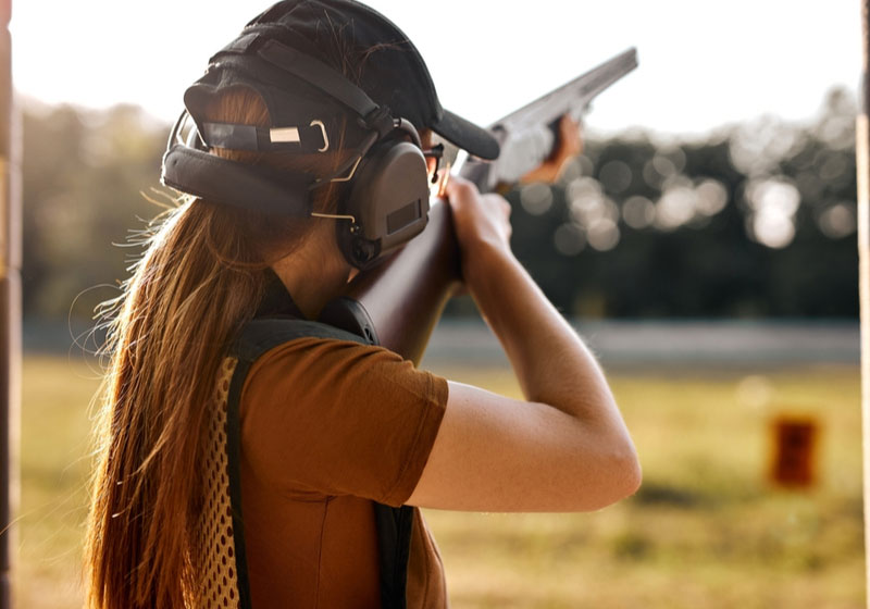 Young woman on tactical gun | Top 7 Best Tactical Shotguns 2022