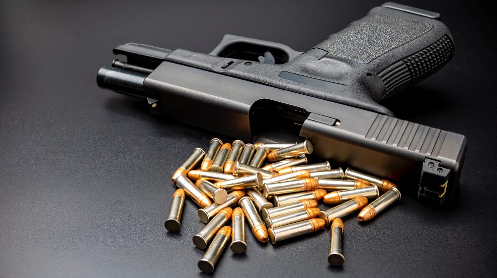 .22 Ammunition and Automatic Gun on Black Background | Best 22 Pistol | Featured