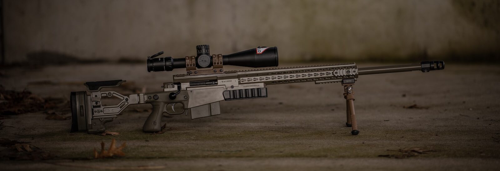 lightest 30-06 battle rifle - a rifle laying on the ground with a scope