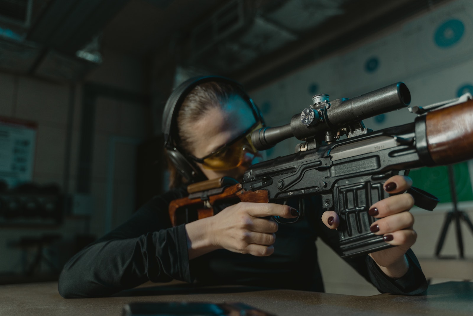 6.8mm Rifle Focused Woman Aiming for the Target