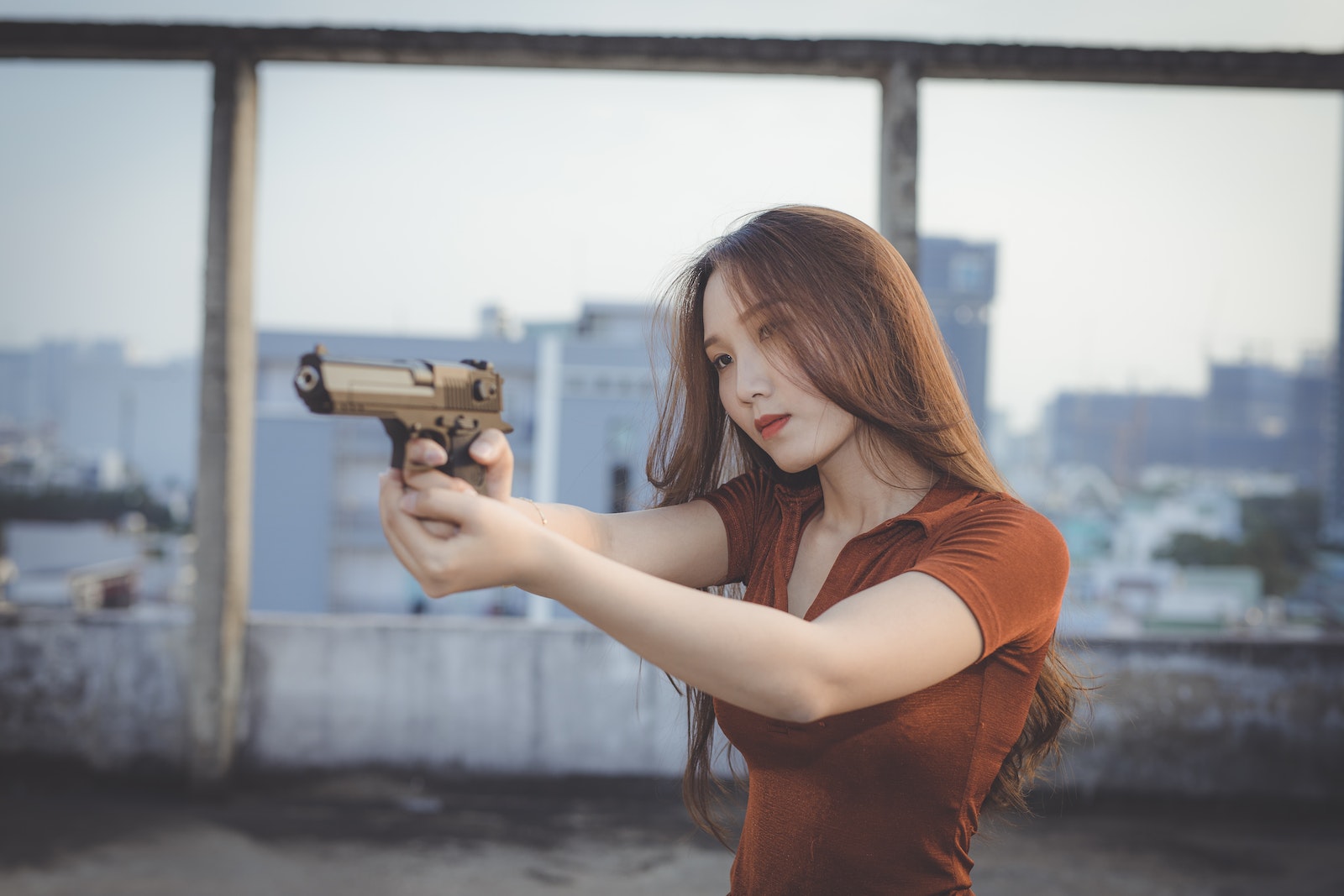 9mm Pistols for Home defense Selective Focus Photo of a Woman Aiming a Gun