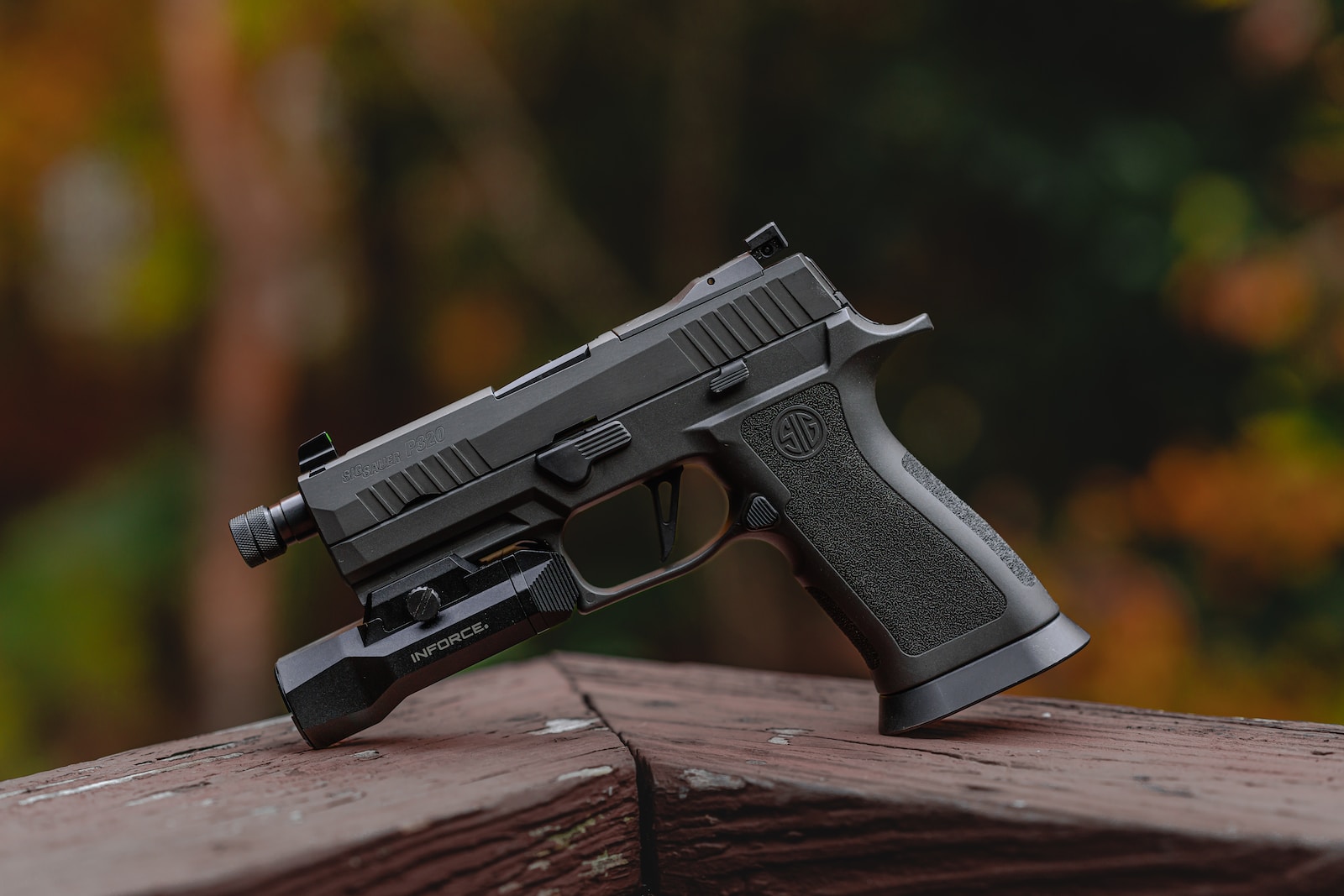 Best handguns under $1000 a close up of a gun on a wooden surface