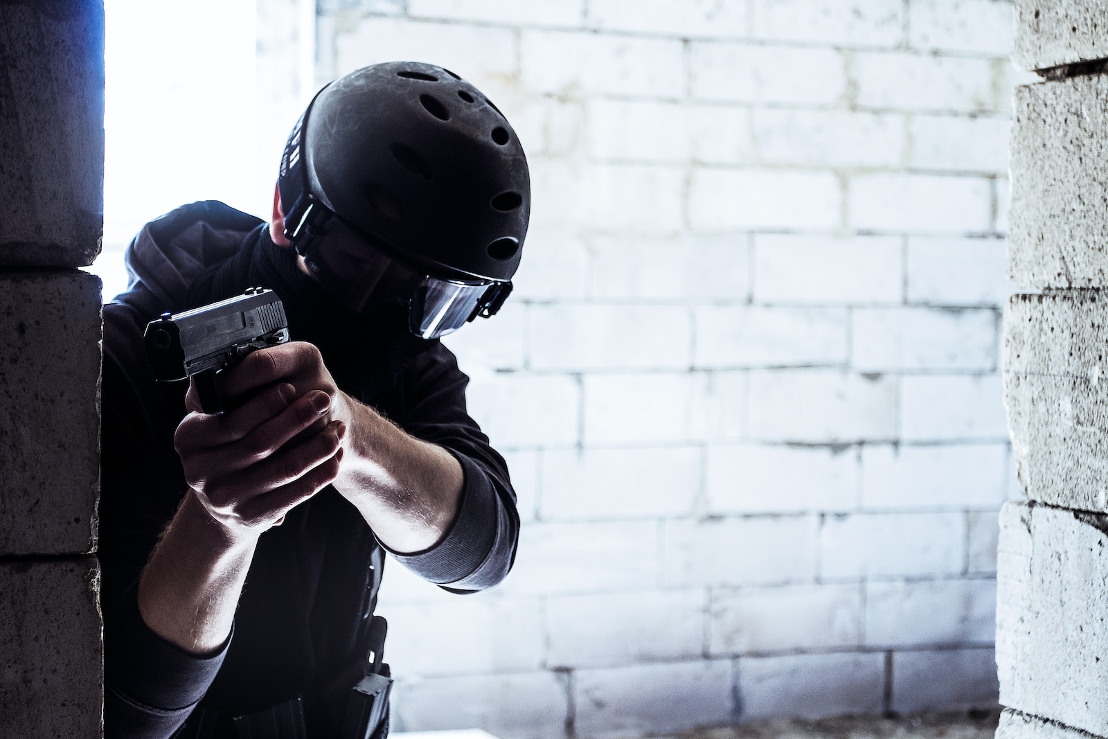 9mm Pistols for Self-Defense man in black helmet holding black smartphone