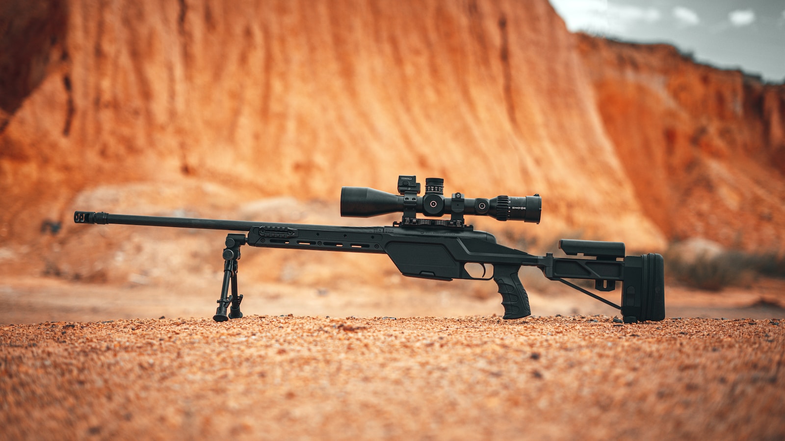 ruger precision rifle black rifle on brown sand