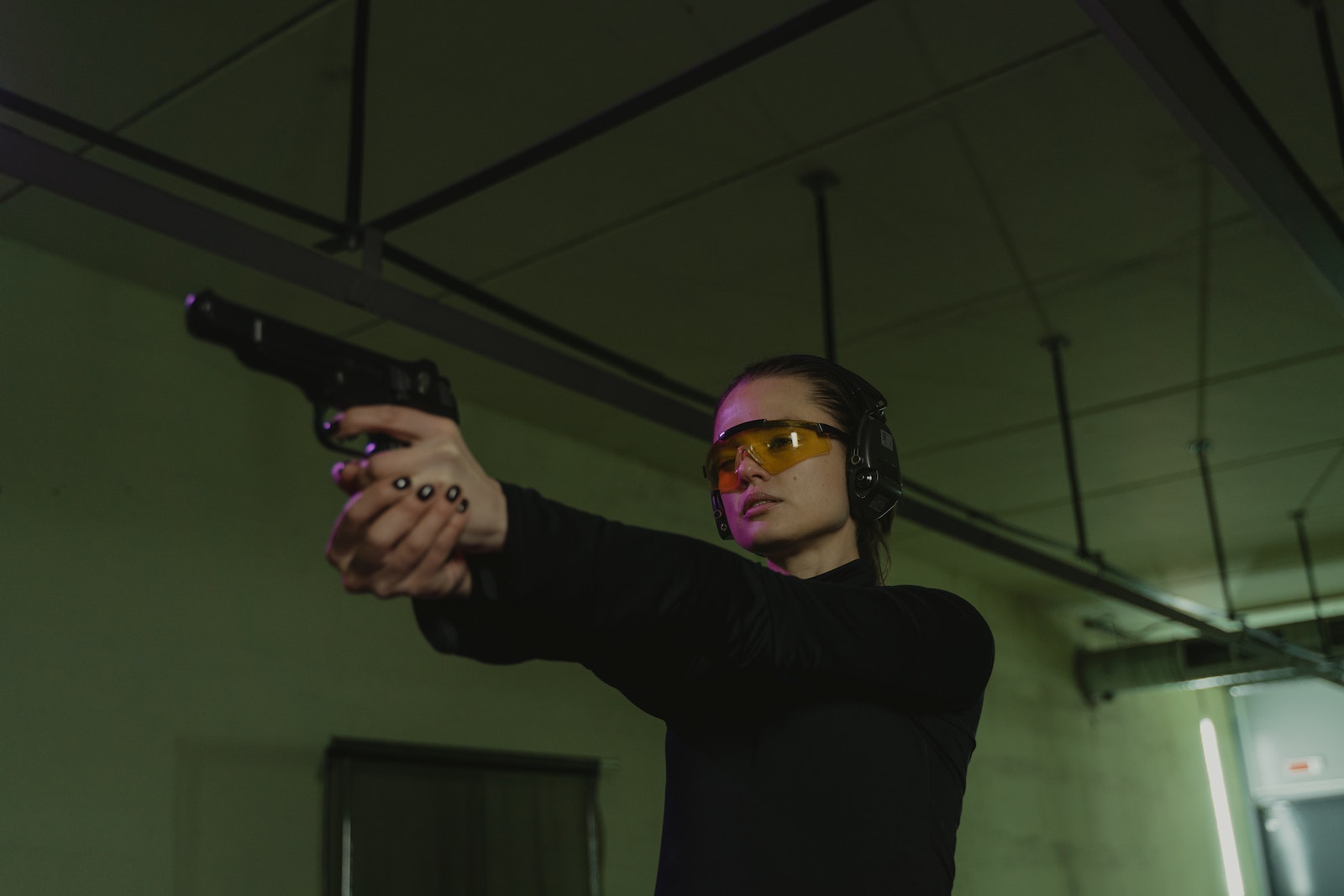 A Woman Holding a  Glock 19 Pistol